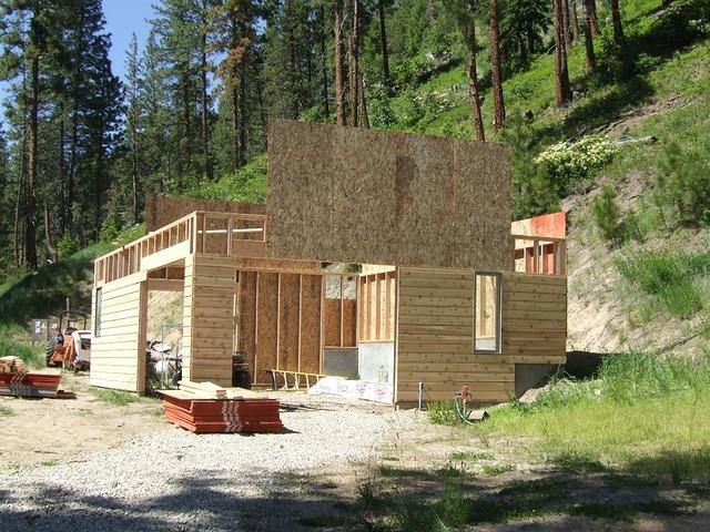 Waiting for the trusses to come for the second floor. Siding is on too.