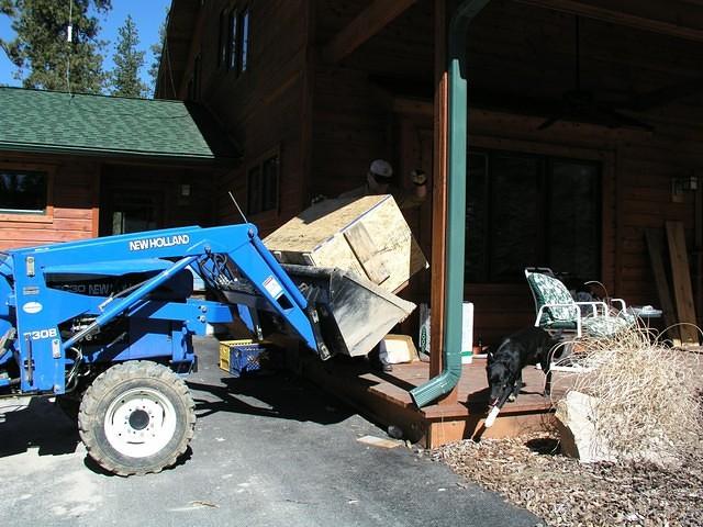 Setting the crate on a cart to roll into the house.