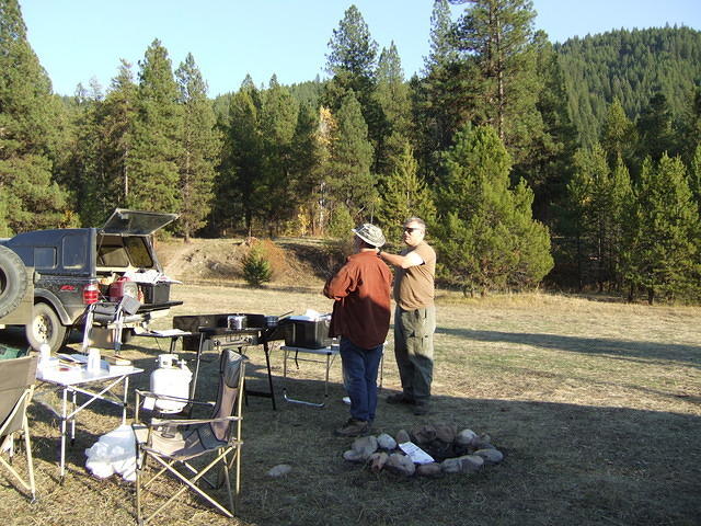 Curtis and Paul discussing hunting plans for tomorrow.