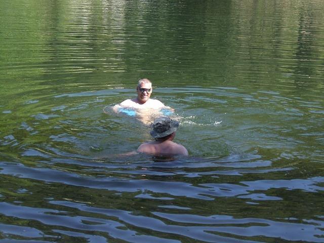 Paul and Curtis go for a swim. Paul is floating, Curtis walking.