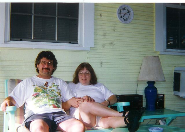 Jane and Curtis on hotel porch.
