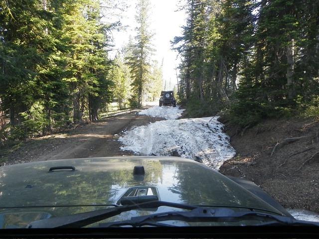 We are at about 7500 feet and meet our first obstacle. Snow in the middle of July!