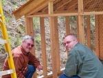 Mike and Curtis put up the wire for the walk-about. The chickens will have a shady place to walk around.
