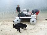 Paul and Curtis finishing up adjusting the boat. Buster is having fun!