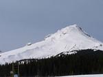 The 'back' side of Mt. Hood where all the skiing is done. You can see a ski lift along the slope.