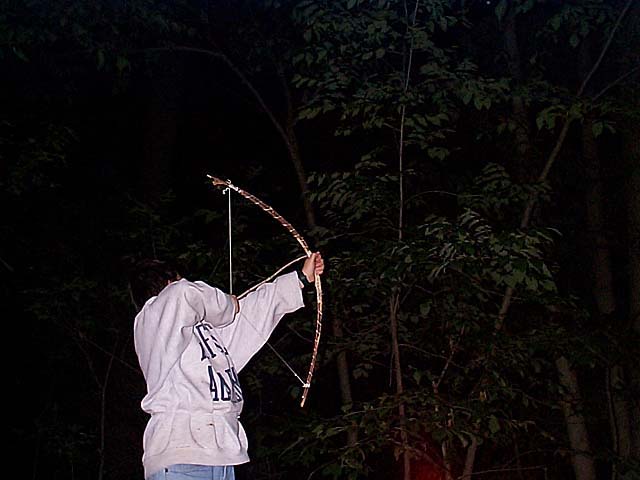 Anthony Shooting His Homemade Bow and Arrow